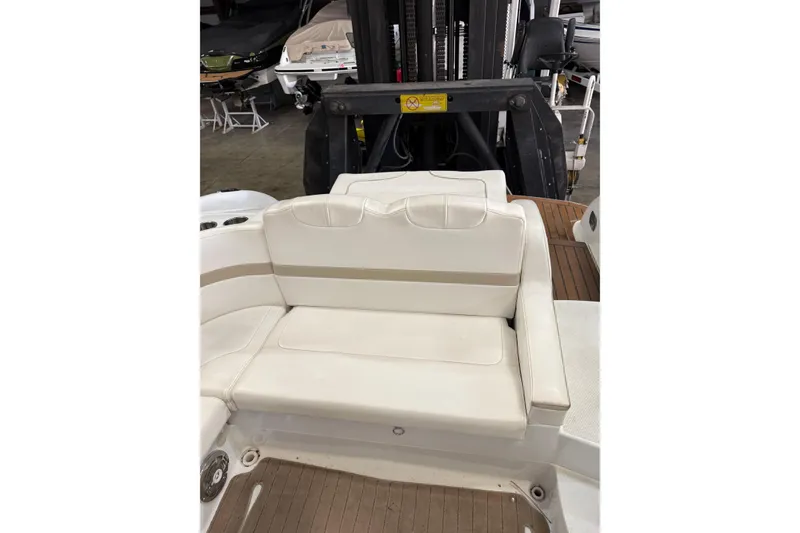 Slide: The Image of 2009 Formula 310 Sun Sport boat interior with white seating and wooden flooring. - 8