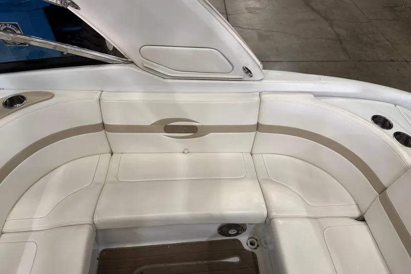 Slide: The Image of 2009 Formula 310 Sun Sport boat interior with white and beige seating. - 9