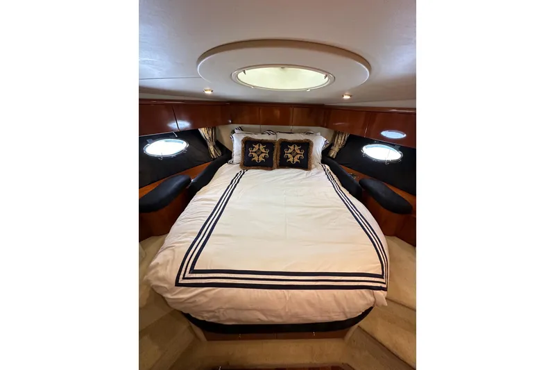 Slide: The Image of Luxurious bedroom interior of 2000 Sunseeker Predator 60 yacht with elegant bedding. - 106