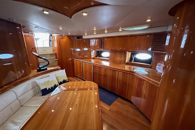 Slide: The Image of Luxurious interior of a 2000 Sunseeker Predator 60 yacht with polished wood finishes. - 110