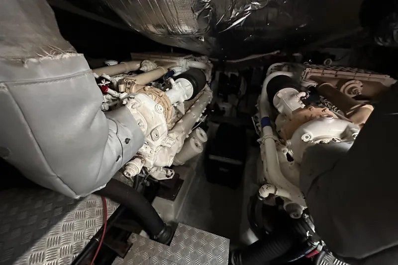 Slide: The Image of Engine room of a 2000 Sunseeker Predator 60 yacht, showcasing dual engines. - 117