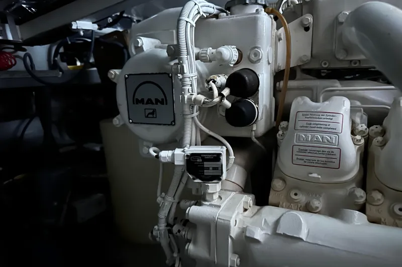 Slide: The Image of Engine compartment of a 2000 Sunseeker Predator 60 yacht, featuring MAN components. - 124