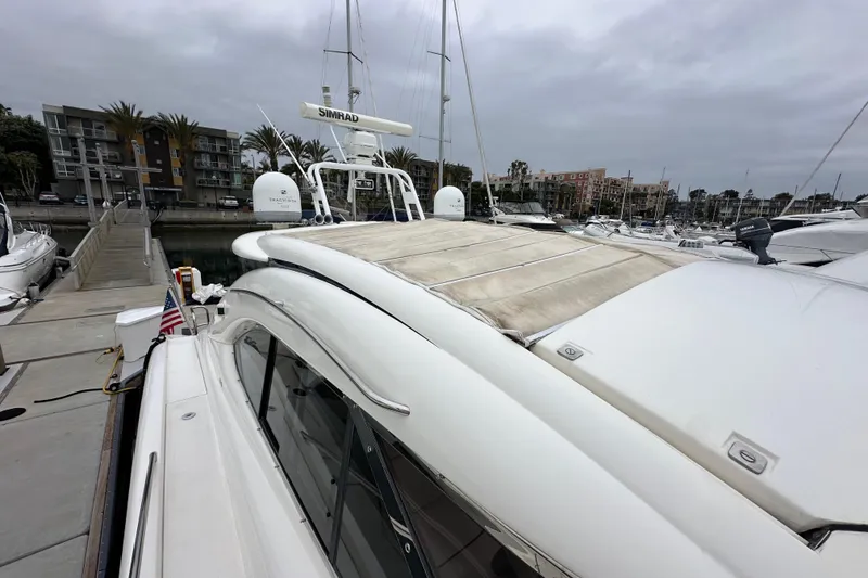 Slide: The Image of Sunseeker Predator 60 yacht docked at marina, overcast sky, 2000 model. - 27