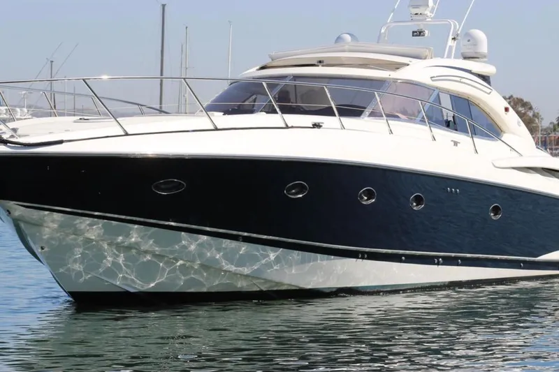 Slide: The Image of Luxury Sunseeker Predator 60 yacht from 2000 on calm water. - 4