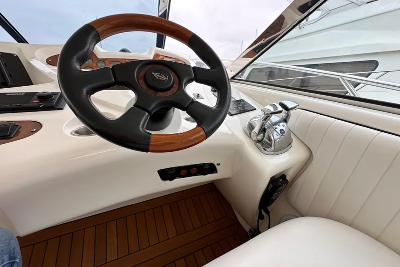 Slide: The Image of Steering wheel and controls of a 2000 Sunseeker Predator 60 yacht. - 46