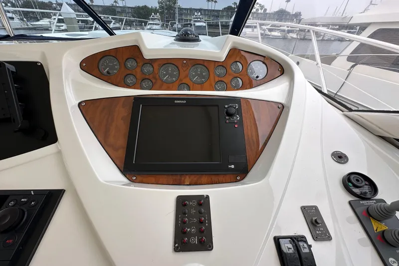 Slide: The Image of Control panel of a 2000 Sunseeker Predator 60 yacht with navigation instruments. - 48