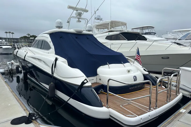 Slide: The Image of Luxury Sunseeker Predator 60 yacht docked, Newport Beach, 2000 model, sleek design. - 6