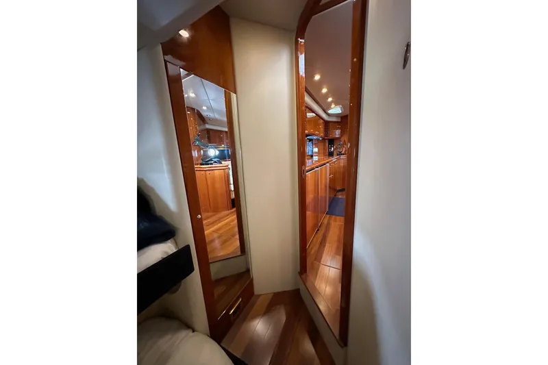 Slide: The Image of Interior view of 2000 Sunseeker Predator 60 yacht, featuring polished wood finishes. - 62