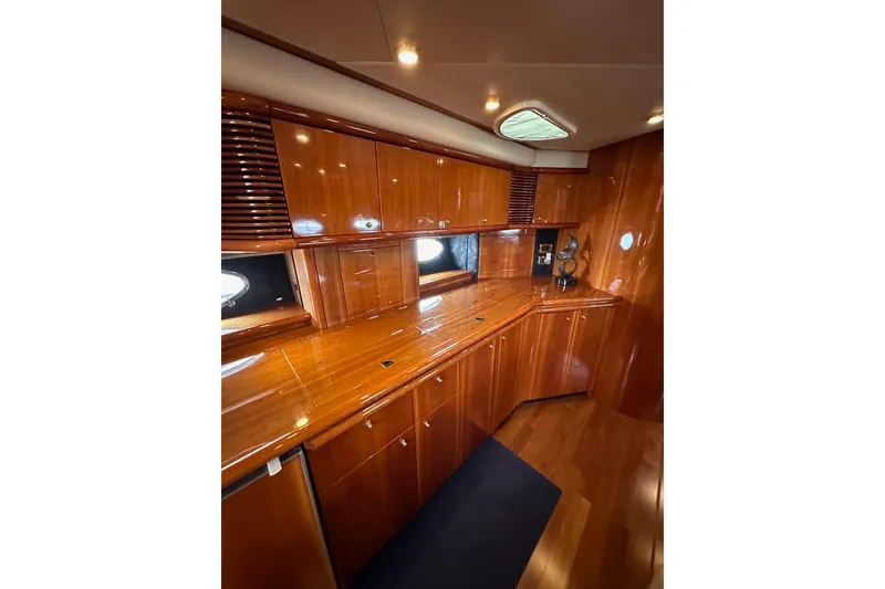 Slide: The Image of Luxurious wooden interior of 2000 Sunseeker Predator 60 yacht kitchen area. - 84