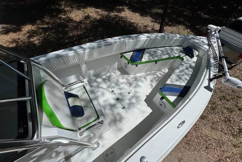 Slide: The Image of 2000 Fountain 31 Tournament Edition boat interior with seating and fishing rod holders. - 12