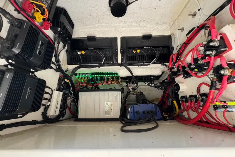 Slide: The Image of Electrical system inside a 2000 Fountain 31 Tournament Edition boat, featuring wiring and components. - 19