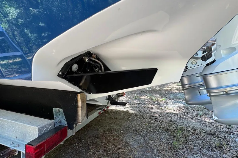 Slide: The Image of Rear view of a 2000 Fountain 31 Tournament Edition boat on a trailer. - 21