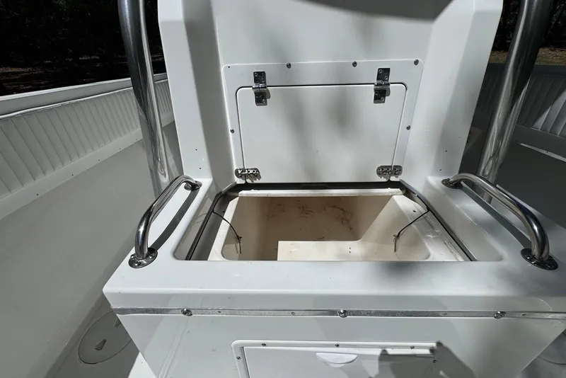 Slide: The Image of Open storage compartment on a 2000 Fountain 31 Tournament Edition boat. - 22