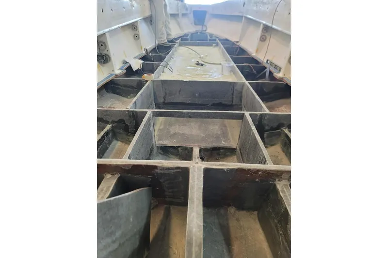 Slide: The Image of Interior view of a 2000 Fountain 31 Tournament Edition boat hull structure. - 26