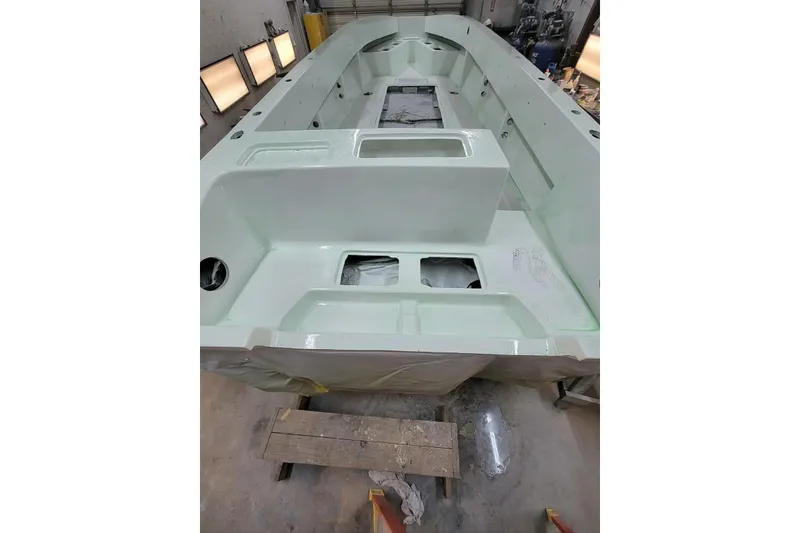 Slide: The Image of 2000 Fountain 31 Tournament Edition boat interior under construction in workshop. - 27