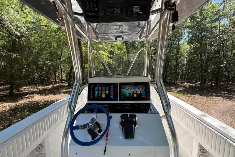 Slide: The Image of Cockpit view of 2000 Fountain 31 Tournament Edition boat with modern navigation system. - 9