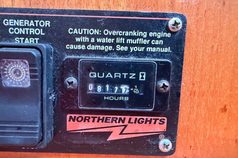 Slide: The Image of Generator control panel with hour meter reading 817.7 hours, Hunter 410, 2002 model. - 14