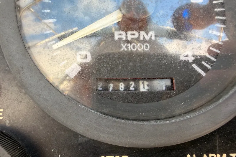 Slide: The Image of Close-up of a dusty RPM gauge on a 2002 Hunter 410 boat. - 13