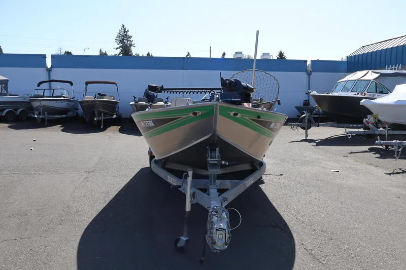 Slide: The Image of 1997 Willie Boats Predator on trailer in a boatyard, surrounded by other boats. - 12