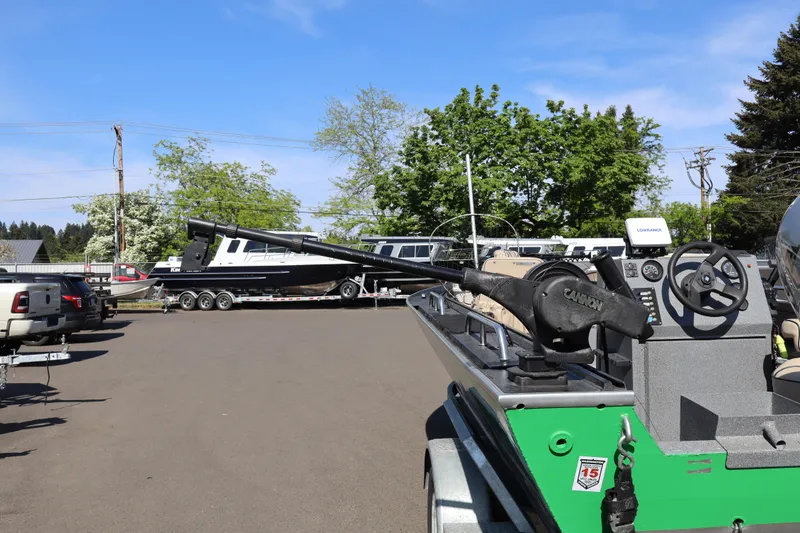 Slide: The Image of 1997 Willie Boats Predator with fishing equipment, parked outdoors on a sunny day. - 4