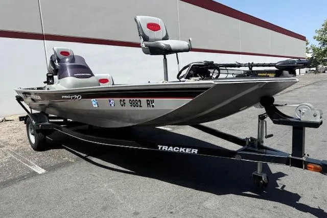 The Image of 2014 Tracker Pro 170 fishing boat on trailer, parked outdoors. - 0
