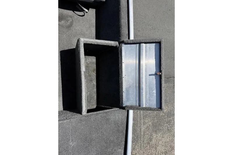 Slide: The Image of Open storage compartment on 2014 Tracker Pro 170 boat deck. - 13