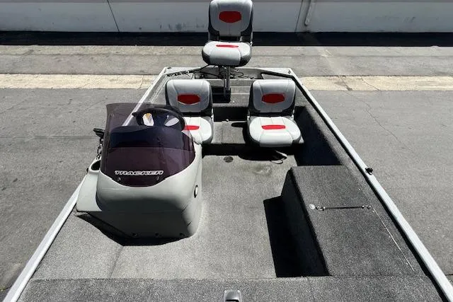 Slide: The Image of 2014 Tracker Pro 170 boat interior with seating and console. - 14