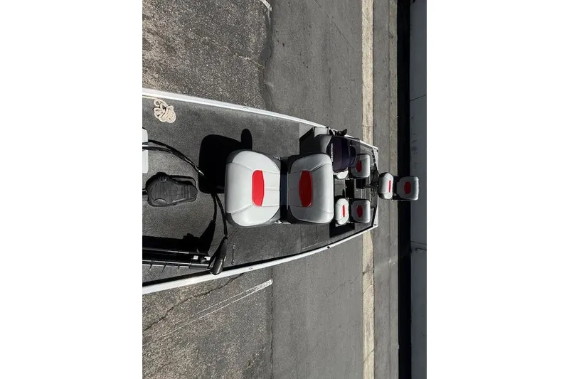Slide: The Image of 2014 Tracker Pro 170 boat interior with gray and red seating, viewed from above. - 15