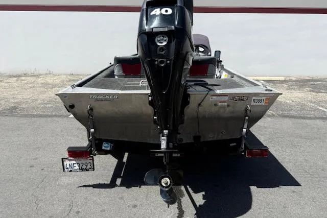 Slide: The Image of 2014 Tracker Pro 170 boat with 40 HP motor, rear view in parking lot. - 21