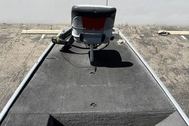 Slide: The Image of 2014 Tracker Pro 170 boat deck with seat, parked on asphalt. - 4