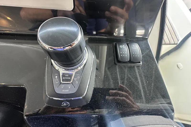 Slide: The Image of Control panel of 2023 Beneteau Antares 11 Coupe with joystick and switches. - 23