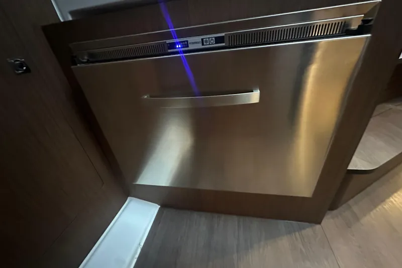 Slide: The Image of Stainless steel dishwasher in 2023 Beneteau Antares 11 Coupe yacht interior. - 25