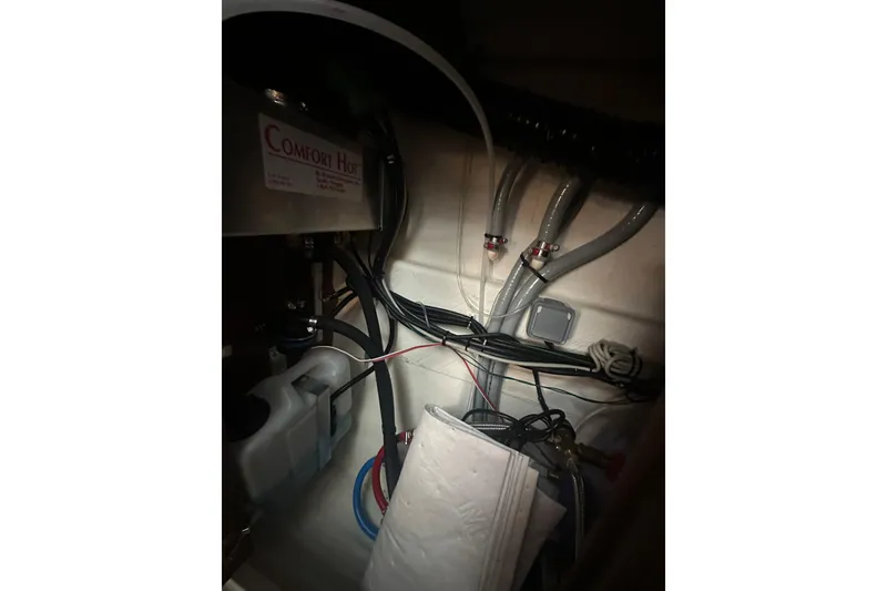 Slide: The Image of Engine compartment of 2023 Beneteau Antares 11 Coupe with Comfort Hot system and wiring. - 27