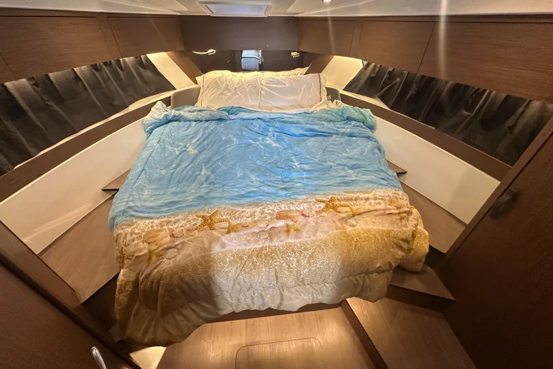 Slide: The Image of Luxurious cabin interior of 2023 Beneteau Antares 11 Coupe with cozy bedding. - 28