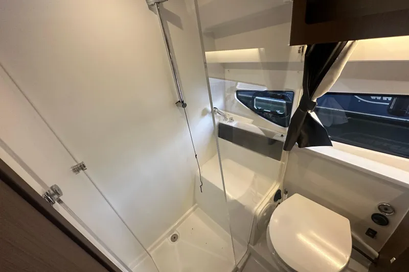 Slide: The Image of 2023 Beneteau Antares 11 Coupe bathroom with shower and toilet, featuring modern design. - 31