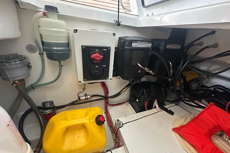 Slide: The Image of Engine compartment of 2023 Beneteau Antares 11 Coupe with power steering components and wiring. - 36