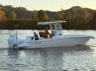 The Image of 2026 Caymas 291 HB boat on calm river at sunset. - 0