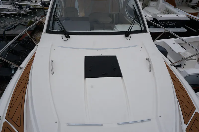 Slide: The Image of 2021 Pursuit OS 325 Offshore boat deck with sleek design and windshield wipers. - 11