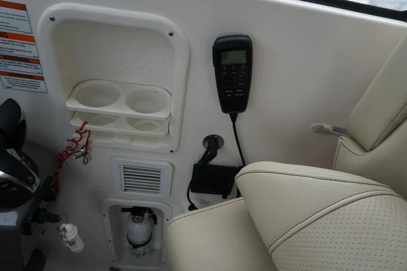 Slide: The Image of Interior of 2021 Pursuit OS 325 Offshore boat with control panel and seating. - 32