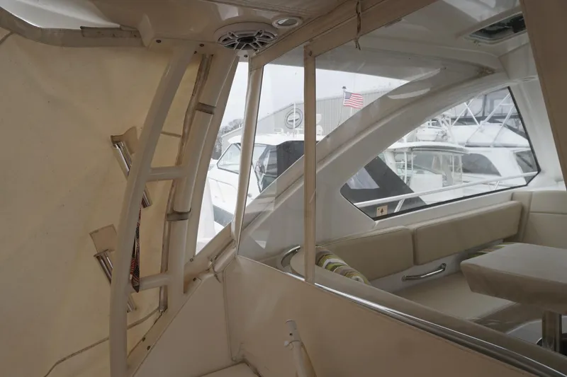 Slide: The Image of Interior view of 2021 Pursuit OS 325 Offshore boat with seating and window. - 35