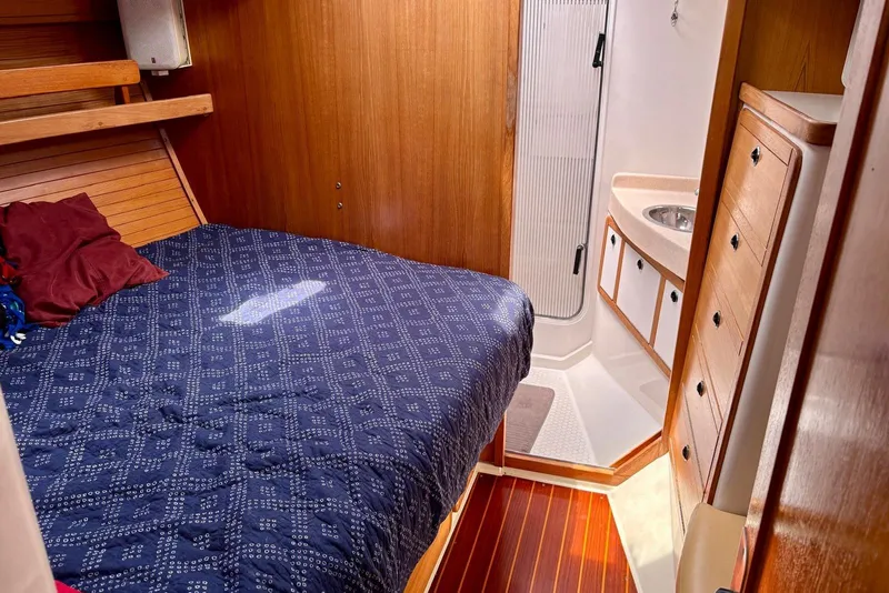 Slide: The Image of Cozy cabin interior of 2000 Catalina 42 MkII sailboat with bed and ensuite bathroom. - 12