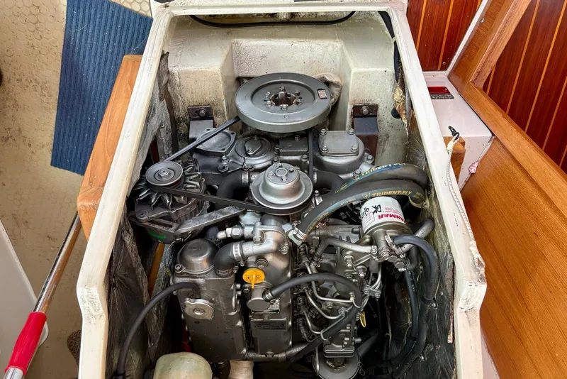 Slide: The Image of Engine compartment of a 2000 Catalina 42 MkII sailboat, showcasing mechanical components. - 19