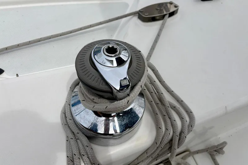Slide: The Image of Winch on 2000 Catalina 42 MkII sailboat deck with coiled rope. - 23
