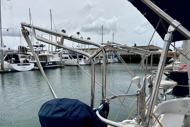 Slide: The Image of Catalina 42 MkII sailboat docked in marina, showcasing stainless steel rigging. - 27