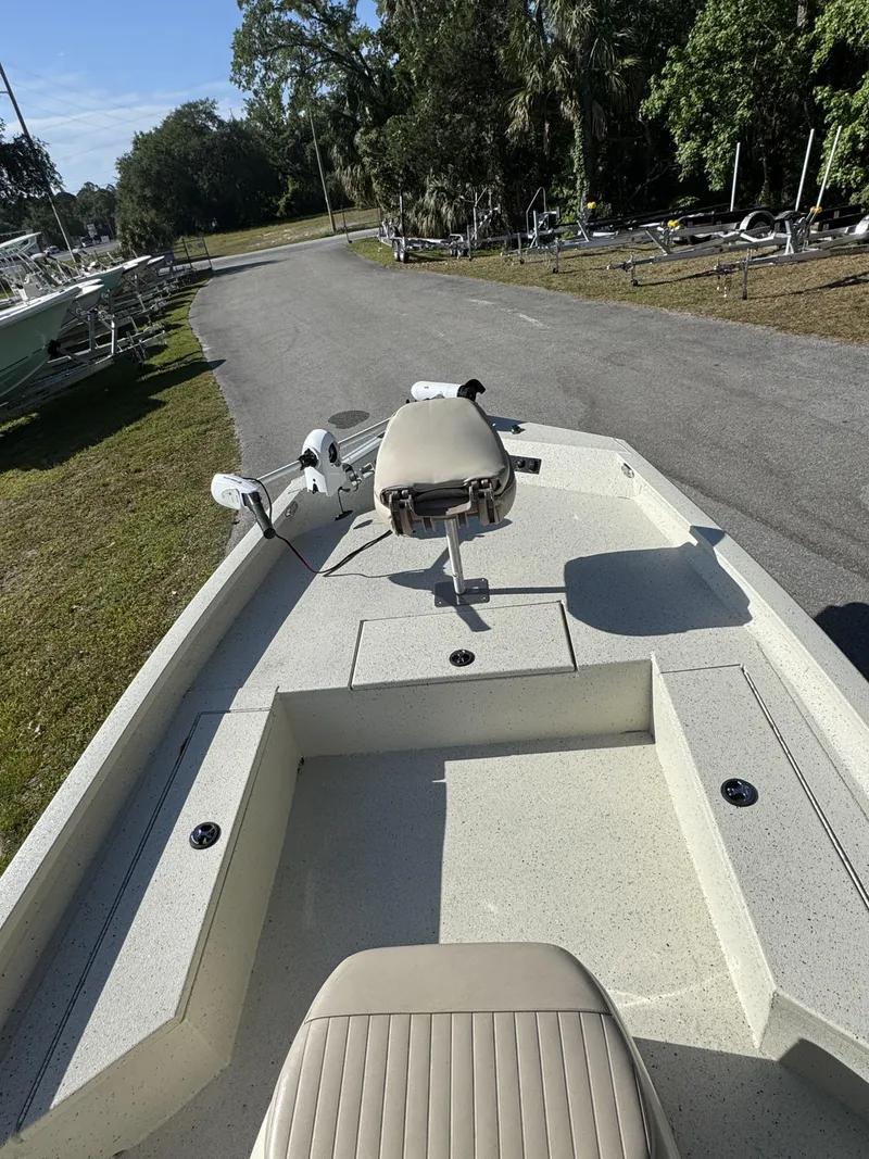 Slide: The Image of 2016 Xpress XP20CC boat parked on a lot with trees. - 11