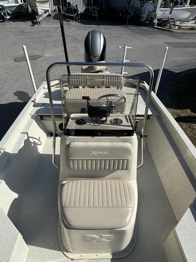 Slide: The Image of 2016 Xpress XP20CC boat with console and seating area. - 12