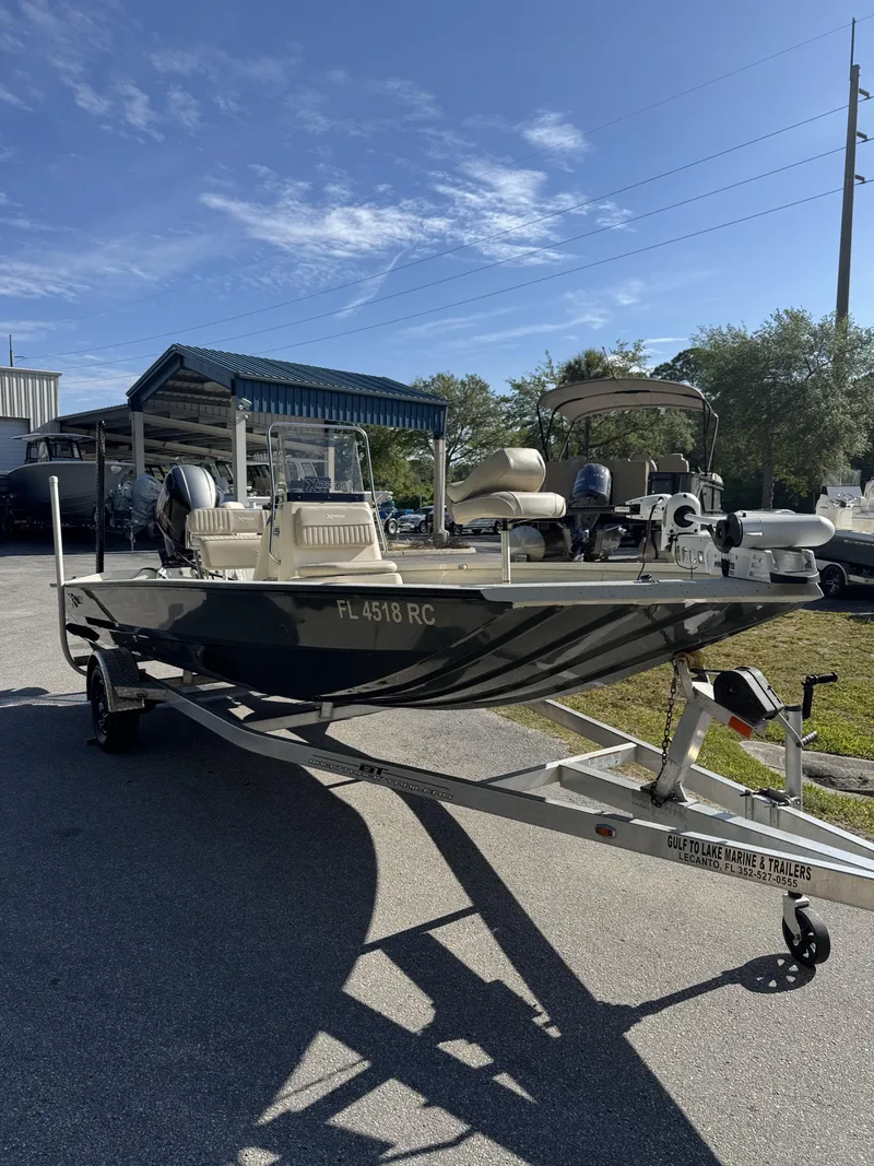 Slide: The Image of 2016 Xpress XP20CC boat on trailer in sunny weather. - 13