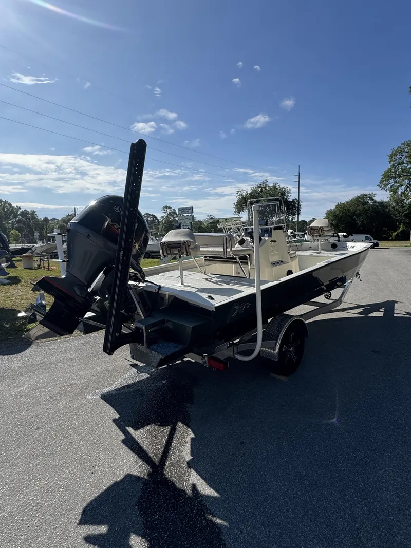 Slide: The Image of 2016 Xpress XP20CC boat on trailer under sunny skies. - 14