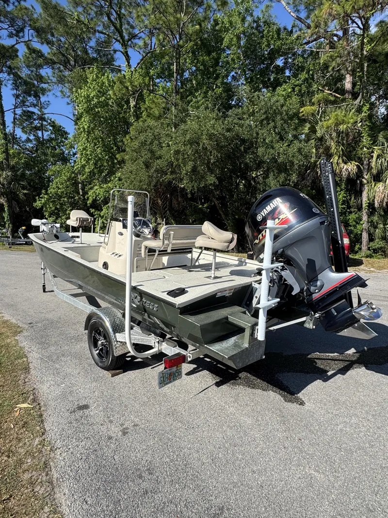 Slide: The Image of 2016 Xpress XP20CC boat with Yamaha outboard motor on trailer. - 18