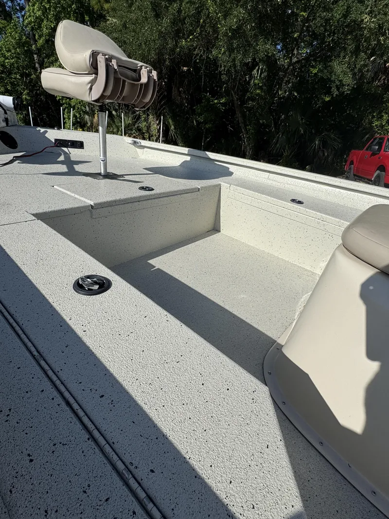 Slide: The Image of 2016 Xpress XP20CC boat with seating and storage area. - 21